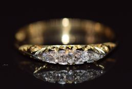 A c1900 18ct gold ring set with five old cut diamonds, 1.8g, size M