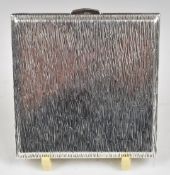 Kigu of London Elizabeth II hallmarked silver compact with retro bark effect design, width 8.5cm