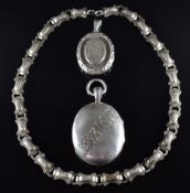 Two Victorian silver lockets with engraved decoration and a Victorian white metal chain