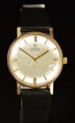 Omega 9ct gold gentleman’s automatic wristwatch with gold hands and baton hour markers, silver