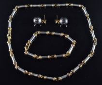 A suite of silver and silver gilt jewellery comprising necklace, earrings and bracelet, 77.6g