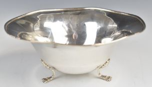 Canadian or American silver bowl raised on three lion paw feet, marked to base P.W. Ellis