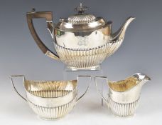 Edward VII hallmarked silver three piece teaset with fluted lower bodies, Sheffield 1903/4, maker