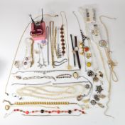 A collection of costume jewellery including vintage earrings, lucite brooches, diamanté, silver