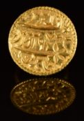 A yellow metal ring mounted with an Indian Mohur gold coin, 12g, size J