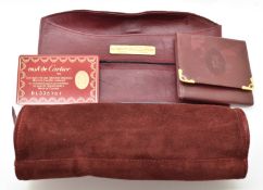 Cartier leather and suede jewellery travel case and a Cartier leather card holder