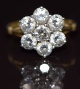 An 18ct gold ring set with seven diamonds, each approximately 0.3ct, in a cluster, 4.6g, size O