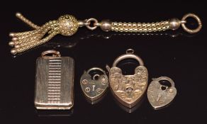 A 9ct gold locket, three 9ct gold heart lockets (6.7g) and a Victorian yellow metal tassel charm,