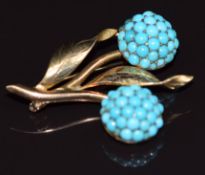 Edwardian 9ct gold brooch set with turquoise cabochons in a floral design, 6.6g