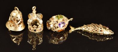 Four 9ct gold charms including a crown set with diamonds, sapphire, amethyst, emeralds and rubies, a