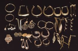 Fourteen pairs of 9ct gold earrings including hoops, cubic zirconia, etc and some single 9ct gold