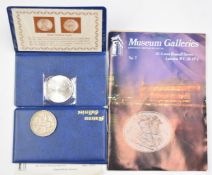 Museum Galleries issue 1935 'rocking horse' crown and a Maria Theresia thaler