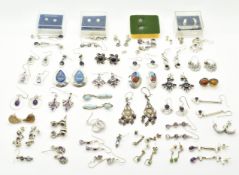 Forty two pairs of silver earrings, mainly set with amethysts