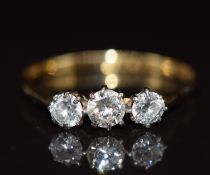 An 18ct gold ring set with three diamonds, 1.6g, size P