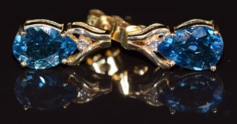A pair of 14k gold earrings set with pear cut topaz and diamonds, 3.1g