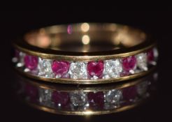 A 10k gold half eternity ring set with alternating rubies and diamonds, 2.6g, size L