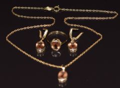 A suite of 14k gold jewellery comprising pendant, earrings and ring, all set with paste, 10.3g all