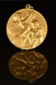 A 9ct gold pendant medallion with embossed cherub decoration by P.Vincze, 3cm, 12g