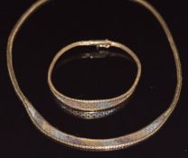 A 9ct gold tri-coloured necklace (40cm) and bracelet,18cm, 24.7g