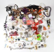 A collection of costume jewellery including earrings, brooches, necklaces, etc
