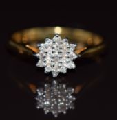 An 18ct gold ring set with a cluster of diamonds totalling 0.15ct, 2.6g, size O