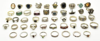 Two silver rings with applied 9k gold decoration and forty silver rings set with pressed amber,