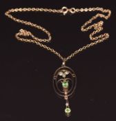 Edwardian 9ct gold pendant set with peridot and seed pearl on 9ct gold chain, 3.9g