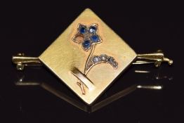 Edwardian 15ct gold brooch set with sapphires and rose cut diamonds in a floral design, 7.7g
