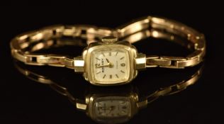 Rotary 9ct gold ladies wristwatch with gold hands and hour markers, silver dial and 21 jewel