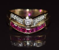 An 18ct gold ring set with calibre cut rubies and diamonds, 4.7g, size K