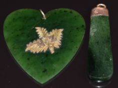 A nephrite jade heart pendant with applied 9ct gold fern decoration and a 9ct gold pendant set