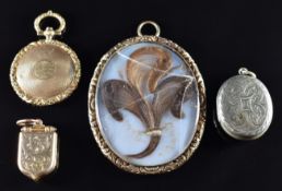 Victorian shield shaped locket with engraved decoration, Victorian locket set with an opalized