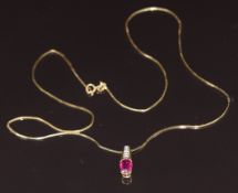 An 18ct gold pendant set with an oval cut pink sapphire of approximately 0.9ct and diamonds, on