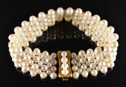 A plaited pearl bracelet with 14k gold clasp