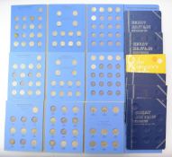 A collection of UK silver threepennies, sixpences, shillings and florins contained in Whitman