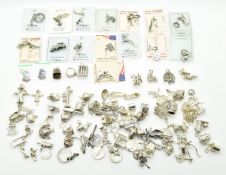 Over ninety silver / white metal charms including an acorn opening to reveal a squirrel, bells,