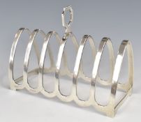George VI hallmarked silver seven bar toast rack, Birmingham 1951, maker Henry Clifford Davis,