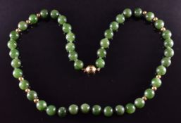 A necklace of nephrite jade and gold beads with 18ct gold clasp