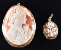 An 18ct gold pendant / brooch set with a cameo depicting a young woman and a 9k gold pendant set