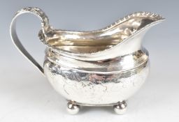 Georgian hallmarked silver milk jug raised on four ball feet, London 1818, maker's mark rubbed but
