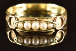 A c1900 15ct gold ring set with five seed pearls, 2.5g, size P