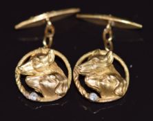 A pair of c1920 18ct gold cufflinks in the form of hounds, each set with a diamond, 10g, in fitted