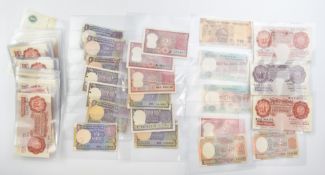 Over 50 Bank of England banknotes to include two £1 Peppiatt 1940-1948 WW2 issue and thirty six 10