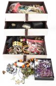 A collection of costume jewellery including silver bracelet, two pearl bracelets, silver earrings