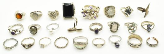 Twenty three silver rings including pearl, amethyst, rose quartz, etc and two 18k gold plated rings
