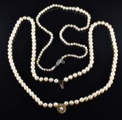 A single strand of cultured pearls with 9ct gold clasp set with a diamond, and a double strand of