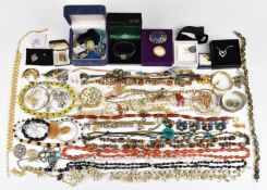 A collection of jewellery including agate beads, vintage, Sarah Coventry and Art Deco brooches,