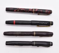 Four pens comprising Conway Stewart No 286 with 14ct gold nib, Osmiroid, Waterman's with 14ct gold
