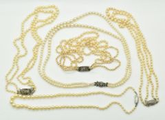 Three double strands of cultured pearls with silver clasps, a triple strand cultured pearl