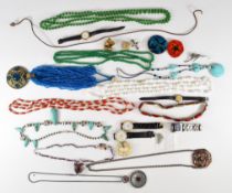 A collection of costume jewellery including glass beaded necklaces, Art Deco necklace, filigree